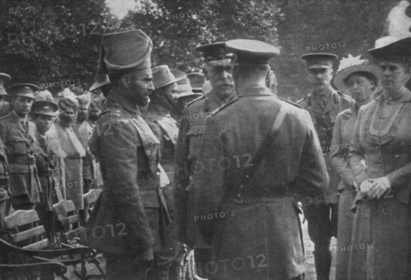'H.M. King George V Talking To Sir Walter Lawrence and Mir Dast, V.C., 25th August 1915', (1939). Artist: Unknown.