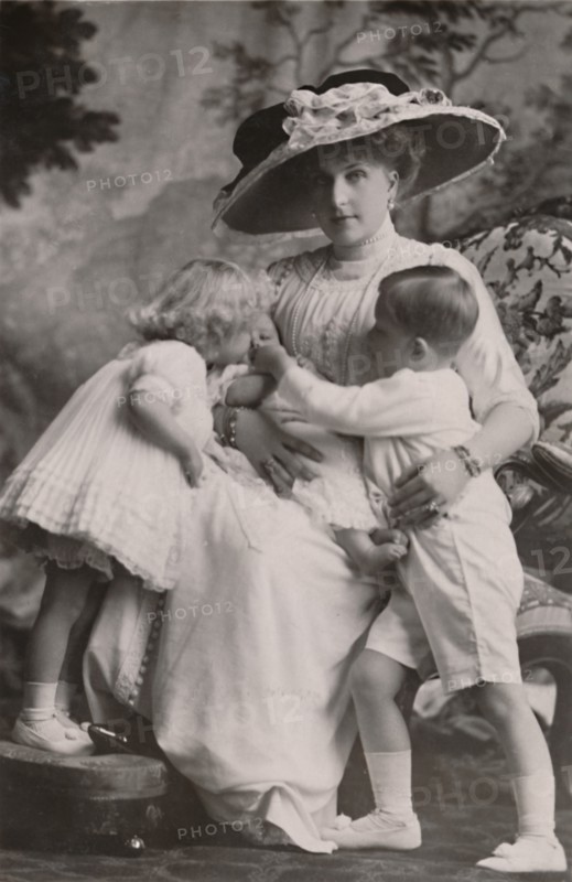 'Queen Victoria of Spain with Prince Alfonso, Princess Maria Christina and Princess Beatrice, 1911.  Creator: Frank Arthur Swaine.