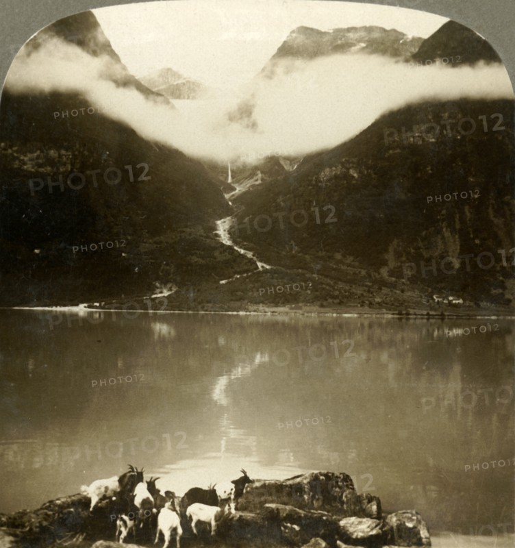 'Grytereids glacier glittering above drifting clouds,  across placid Lake Olden, Norway', c1905. Creator: Unknown.