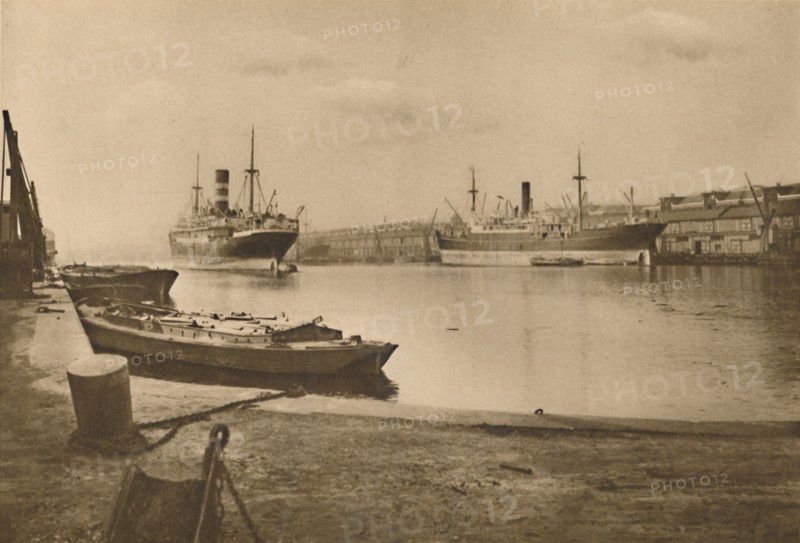 'Carriers of London's Food: Unloaded Cargo Boats in the South Dock of the West India Docks', c1935. Creator: Langfier.