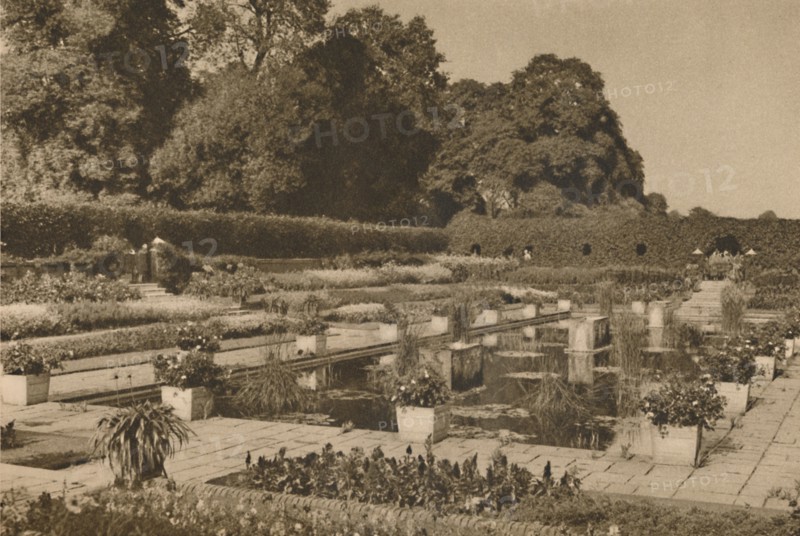 'The Quiet of the Dutch Garden at Kensington Palace Guarded By Locked Gates', c1935. Creator: Unknown.