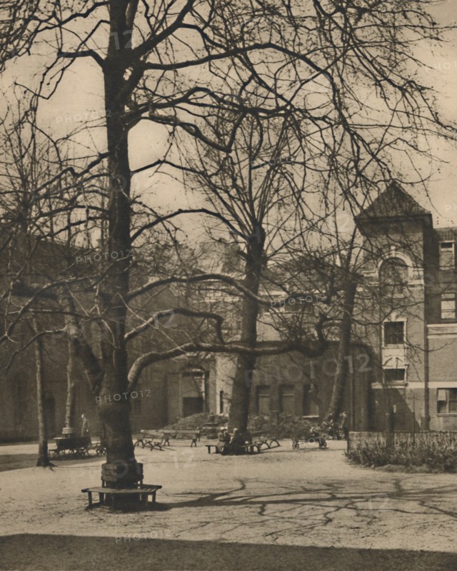 'Under the Elms in the Courtyard of Middlesex Hospital', c1935. Creator: Joel.