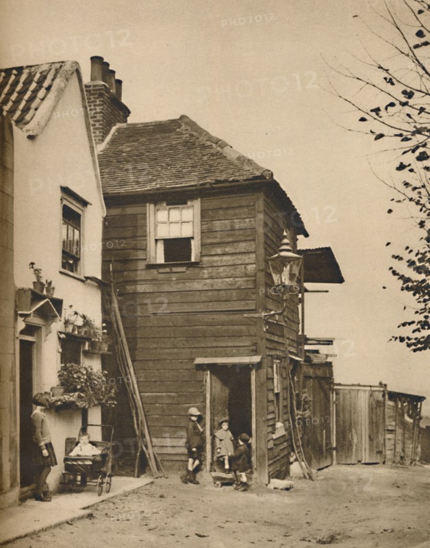 'Old Houses in Highgate From Whose Doorways Villagers Watched the Coaches Pass.', c1935. Creator: Unknown.
