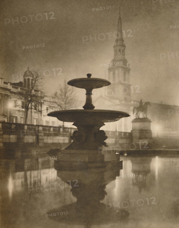 'Night Rain Has Turned The Pavements To A Pool of Reflections', c1935. Creator: Calkin.