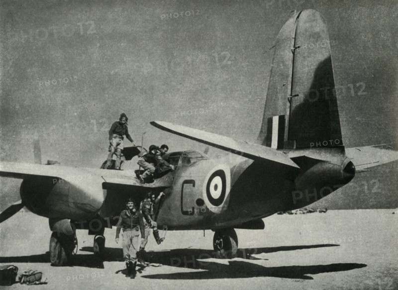 'The hot sun streams down on a desert landing ground', c1942-1943, (1945). Creator: Unknown.