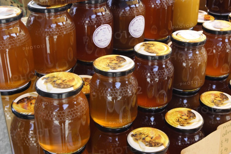 Jars of honey on a market stall, Mallorca, Spain.