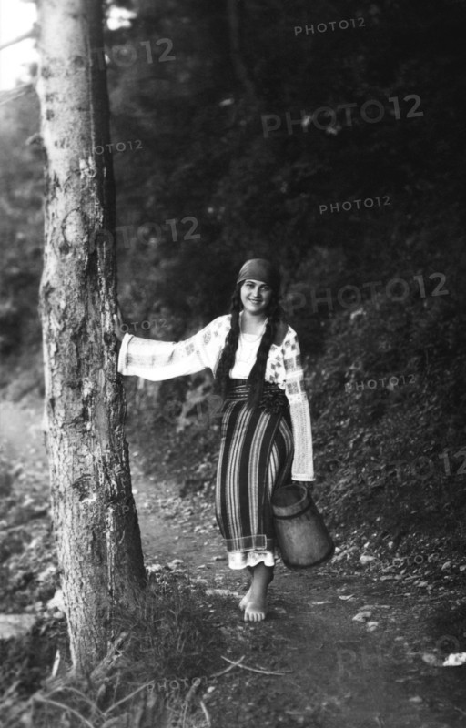 Young woman on a forest path, Bistrita Valley, Moldavia, north-east Romania, c1920-c1945. Artist: Adolph Chevalier