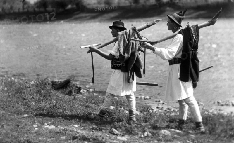 Foresters carrying their tools, Bistrita Valley, Moldavia, north-east Romania, c1920-c1945. Artist: Adolph Chevalier