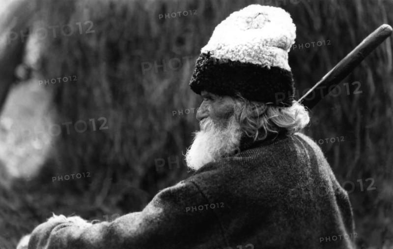 Old man wearing a woolly hat, Bistrita Valley, Moldavia, north-east Romania, c1920-c1945. Artist: Adolph Chevalier