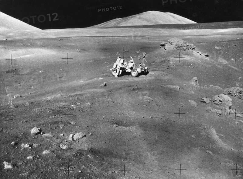 Lunarscape of Station 4, showing Harrison Schmitt at the lunar roving vehicle, 1972.  Creator: Unknown.