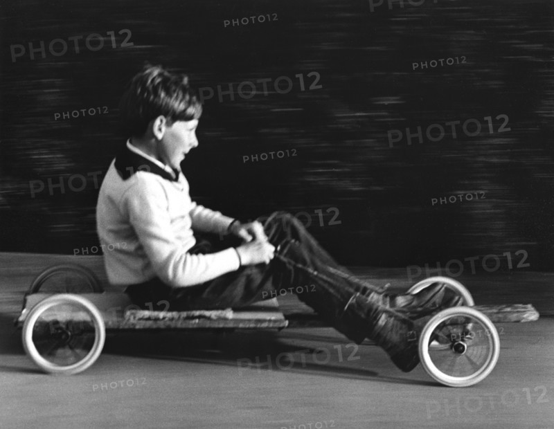 Boy driving a home-made go-kart, Horley, Surrey, 1965.