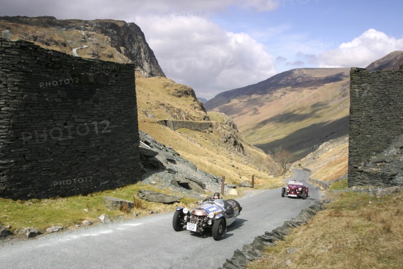 Vintage cars climbing Honister Pass, Lake District, Cumbria.