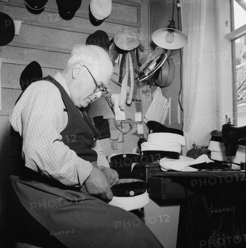 A hatter making a cap, Landskrona, Sweden, 1949. Artist: Unknown