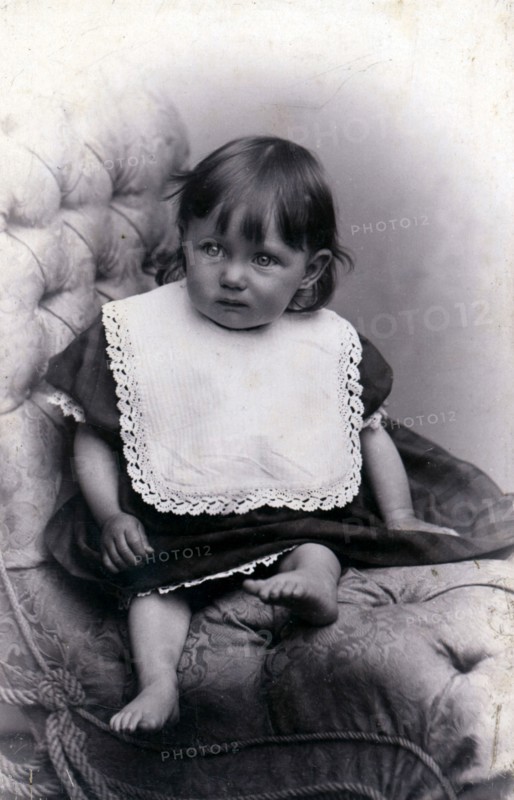 Portrait of a little girl in a big chair, c1910. Artist: Unknown