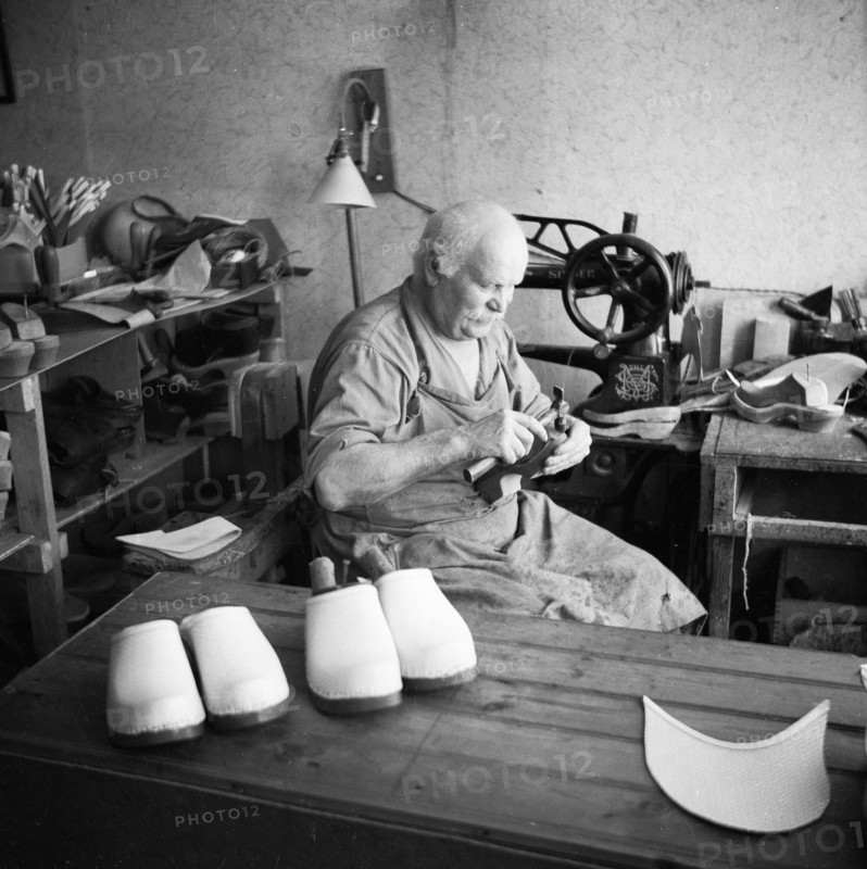 Making wooden clogs, Sweden. Artist: Unknown