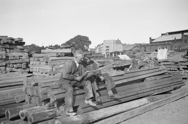 Two men in a woodyard, Landskrona, Sweden, 1935. Artist: Unknown