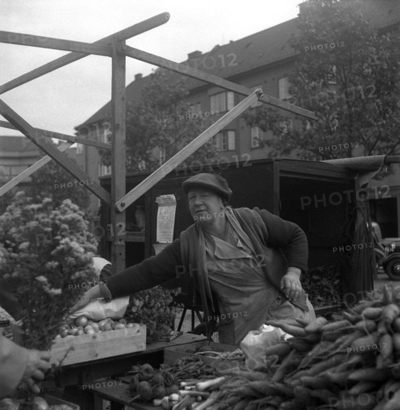 Fruit and vegetable stall in the market, Malmö, Sweden, 1947. Artist: Otto Ohm
