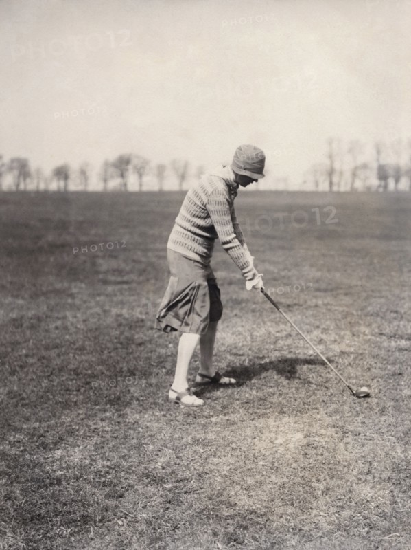 A lady golfer playing at Falsterbo Colf Club, Sweden. Artist: Otto Ohm