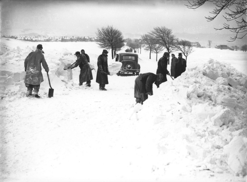 German/Italian prisoners of war clearing snow on Fairfield Common, Buxton, Derbyshire, 1947. Artist: JD Meddins