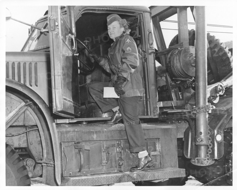An American WAC sergeant climbing into an army truck, Fort Sheridan, Illinois, USA, 1940s. Artist: Unknown
