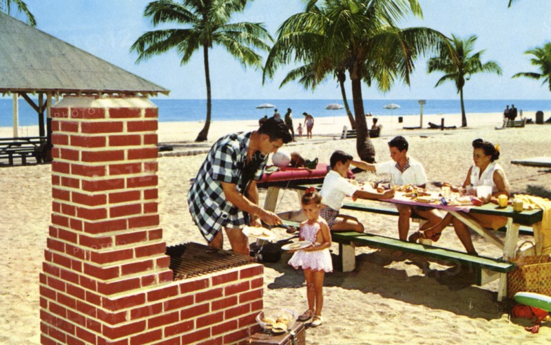 A family enjoying a picnic and barbecue on a sandy beach in Florida, USA, 1957. Artist: Unknown