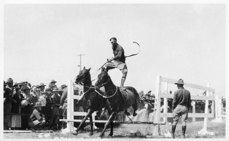 Soldier performing equestrian acrobatics, Fort Sheridan, Illinois, USA, 1940. Artist: Unknown
