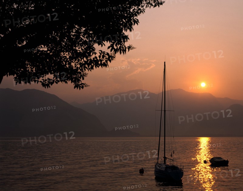 Yacht at sunset, Lake Maggiore, Italy.