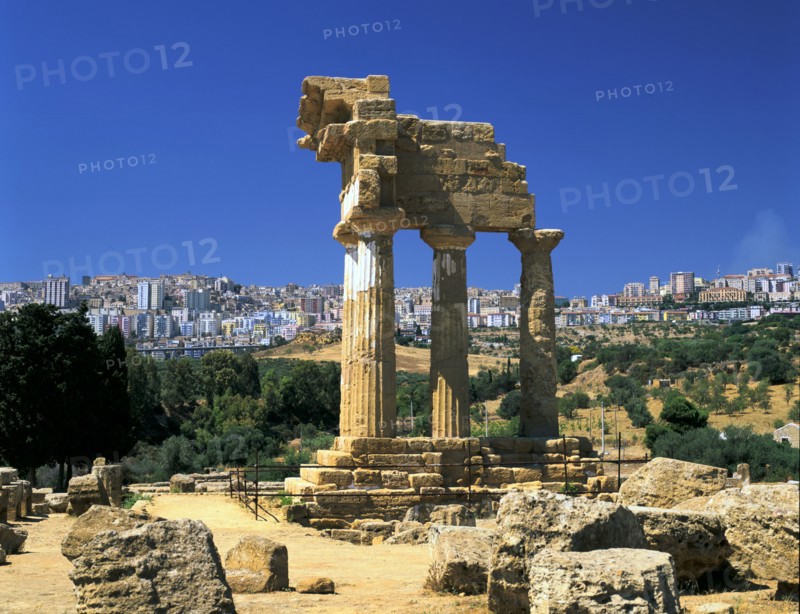 Temple of Diosuri, Agrigento, Sicily, Italy. Agrigento town behind.