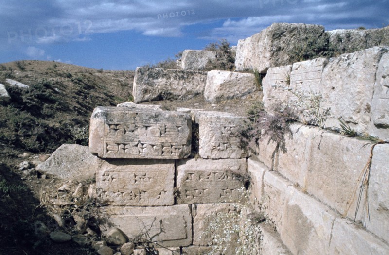 Cuneiform inscriptions on stones, ruined aqueduct, Jerwan, Iraq, 1977.