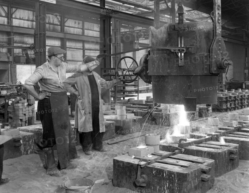 Pouring a small casting at Edgar Allen's Steel foundry, Sheffield, South Yorkshire, 1963. Artist: Michael Walters