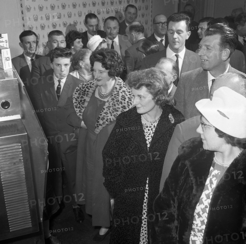 Women in fur coats at a food exhibition, Wilsic, near Doncaster, South Yorkshire, 1961.  Artist: Michael Walters