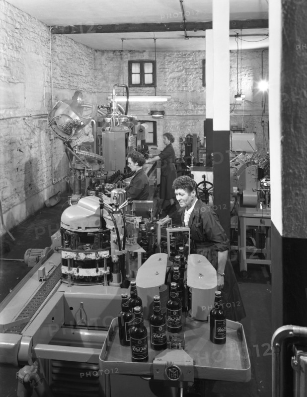 The final stages of bottling whisky at Wiley & Co, Sheffield, South Yorkshire, 1960.  Artist: Michael Walters