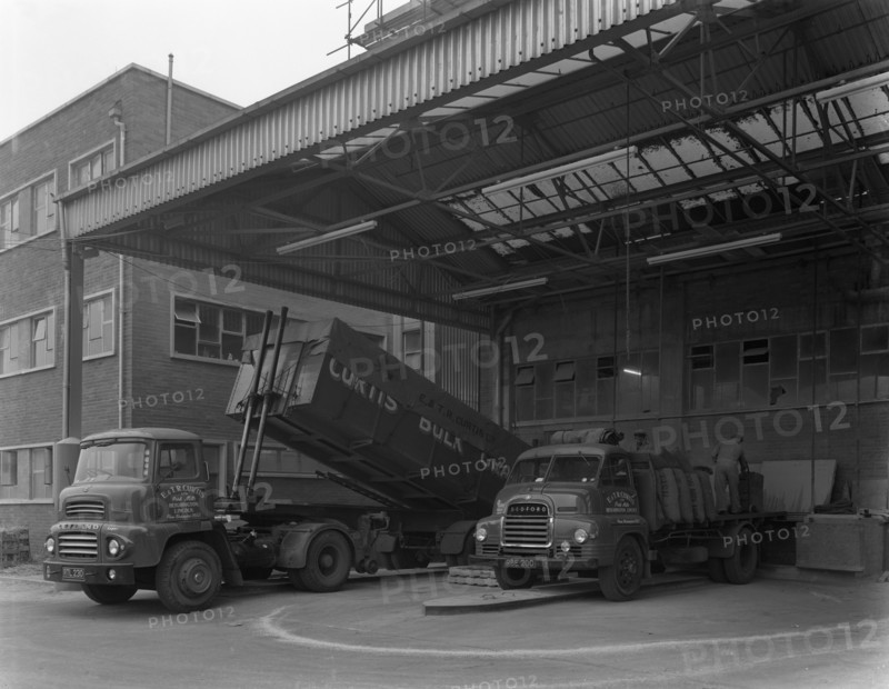 Unloading and loading lorries, Spillers Animal Foods, Gainsborough, Lincolnshire, 1961.  Artist: Michael Walters