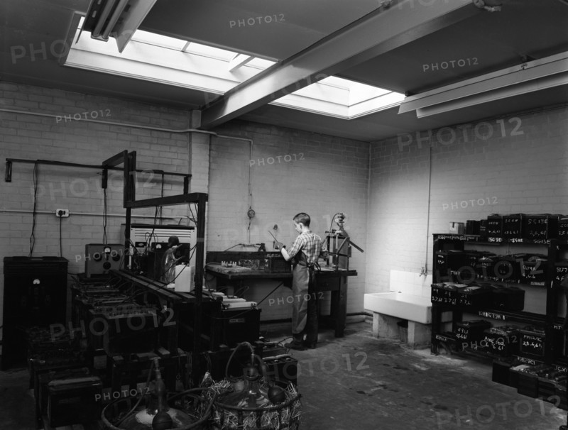 Scene in the workshops of Globe & Simpson auto electricians, Lincoln, Lincolnshire, 1961. Artist: Michael Walters
