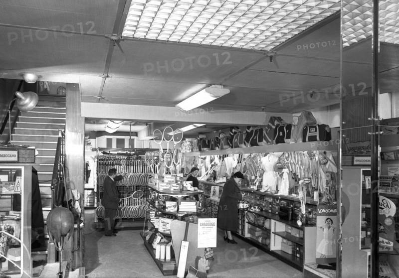 Customers in the Barnsley Co-op's sports department, South Yorkshire, 1957. Artist: Michael Walters