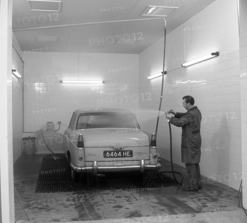 A 1961 Austin Westminster in a car wash, Grimsby, 1965.  Artist: Michael Walters