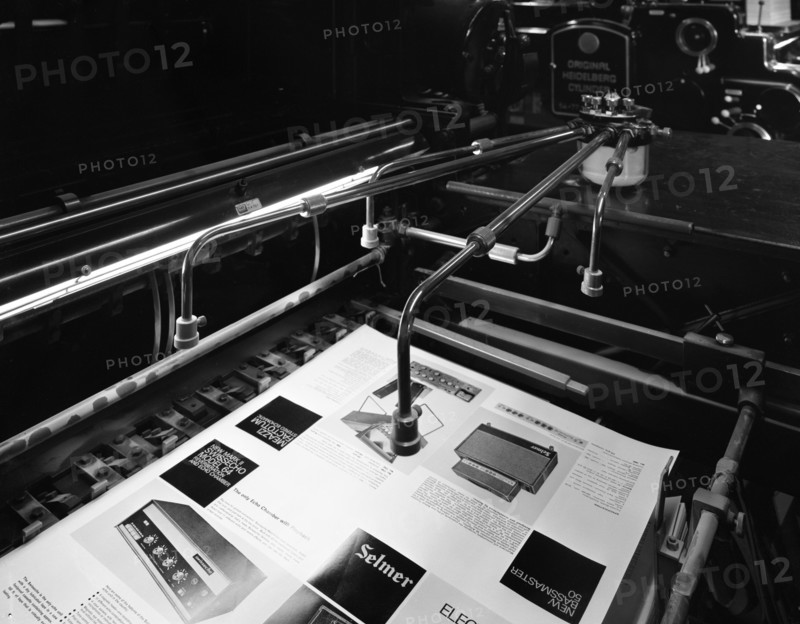 Heidleberg cylinder press in operation at a printworks, Mexborough, South Yorkshire, 1959. Artist: Michael Walters
