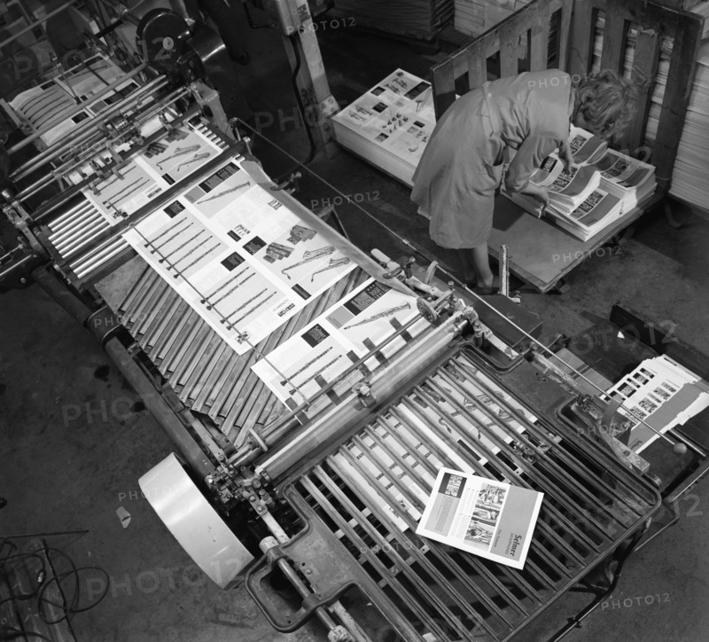 Stacking finished brochures at a printers, Mexborough, South Yorkshire, 1959. Artist: Michael Walters