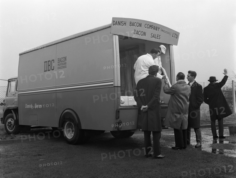 Traders buying bacon direct from a Danish Bacon wholesale van, Kilnhurst, South Yorkshire, 1961. Artist: Michael Walters