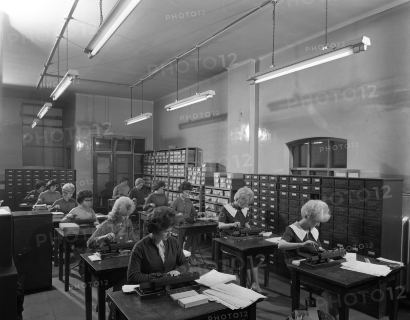 Tabulating machines in the punch room in a Sheffield Factory office, 1963.  Artist: Michael Walters