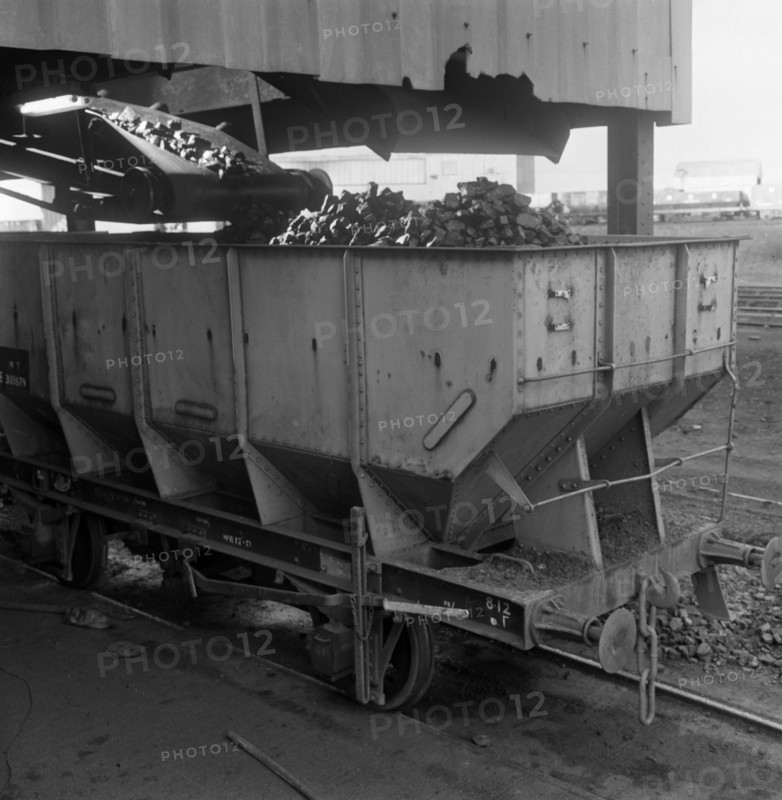 A rail truck being loaded with coal, Lynemouth Colliery, Northumberland, 1963. Artist: Michael Walters