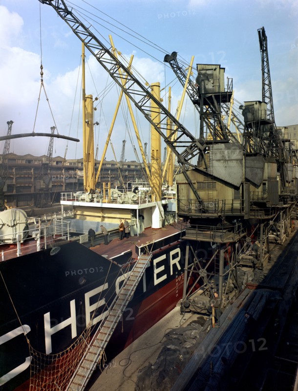The 'Manchester Renown' being loaded with steel for export, Manchester, 1964.  Artist: Michael Walters