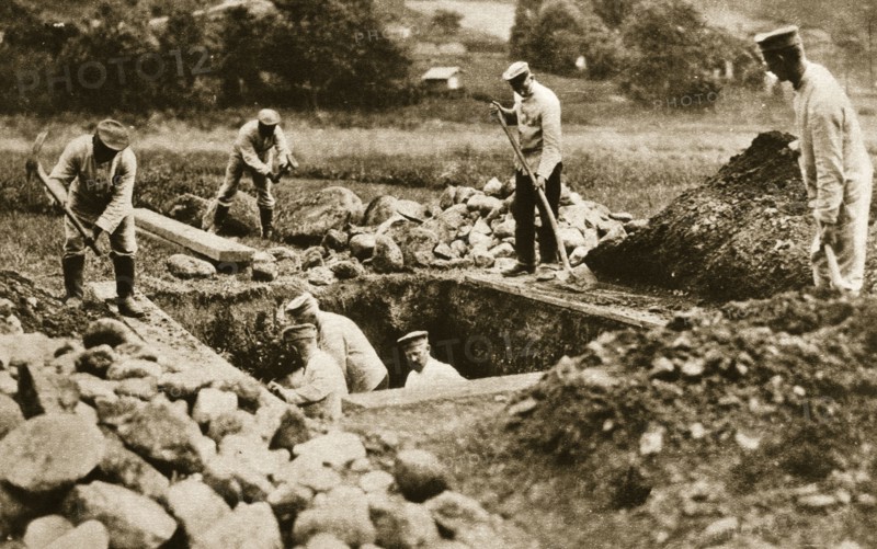 Digging mass graves behind the German lines, World War I, c1914-c1918. Artist: Unknown