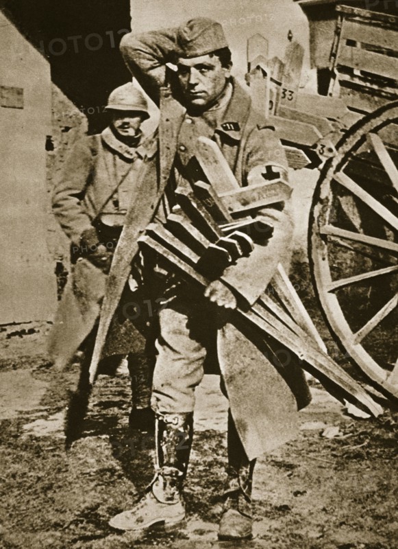 French soldier with wooden crosses to be placed on temporary graves, World War I, c1914-c1918. Artist: Unknown