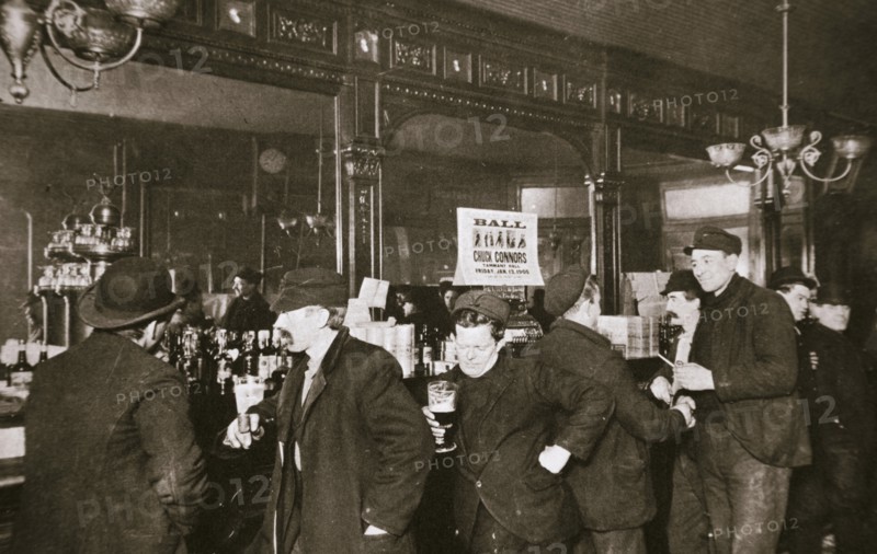 Customers drinking in a bar in the Bowery, New York City, USA, 1900s. Artist: Unknown