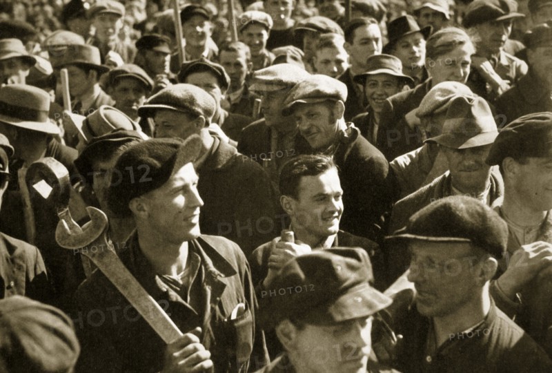 Factory workers with their tools celebrate the traditional Socialist holiday, Germany, 1936. Artist: Unknown