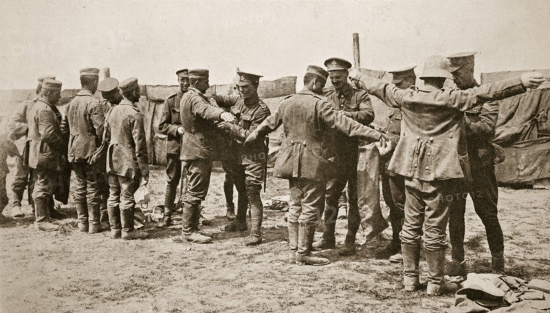 British soldiers searching captured German prisoners, Somme campaign, France, World War I, 1916. Artist: Unknown