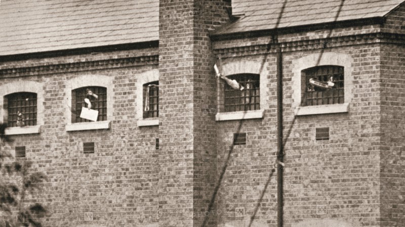 Hunger strikers waving to Christabel Pankhurst from their cells in Holloway Prison, London, 1909. Artist: Unknown