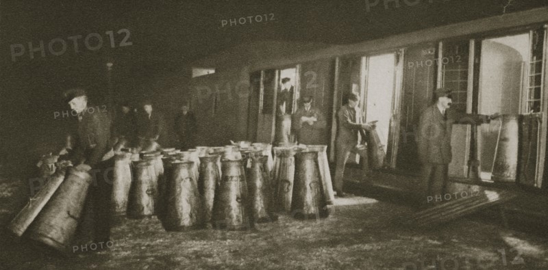Unloading a milk train, London, 20th century. Artist: Unknown