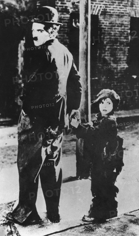 Charlie Chaplin and Jackie Coogan in 'The Kid', 1921. Artist: Unknown